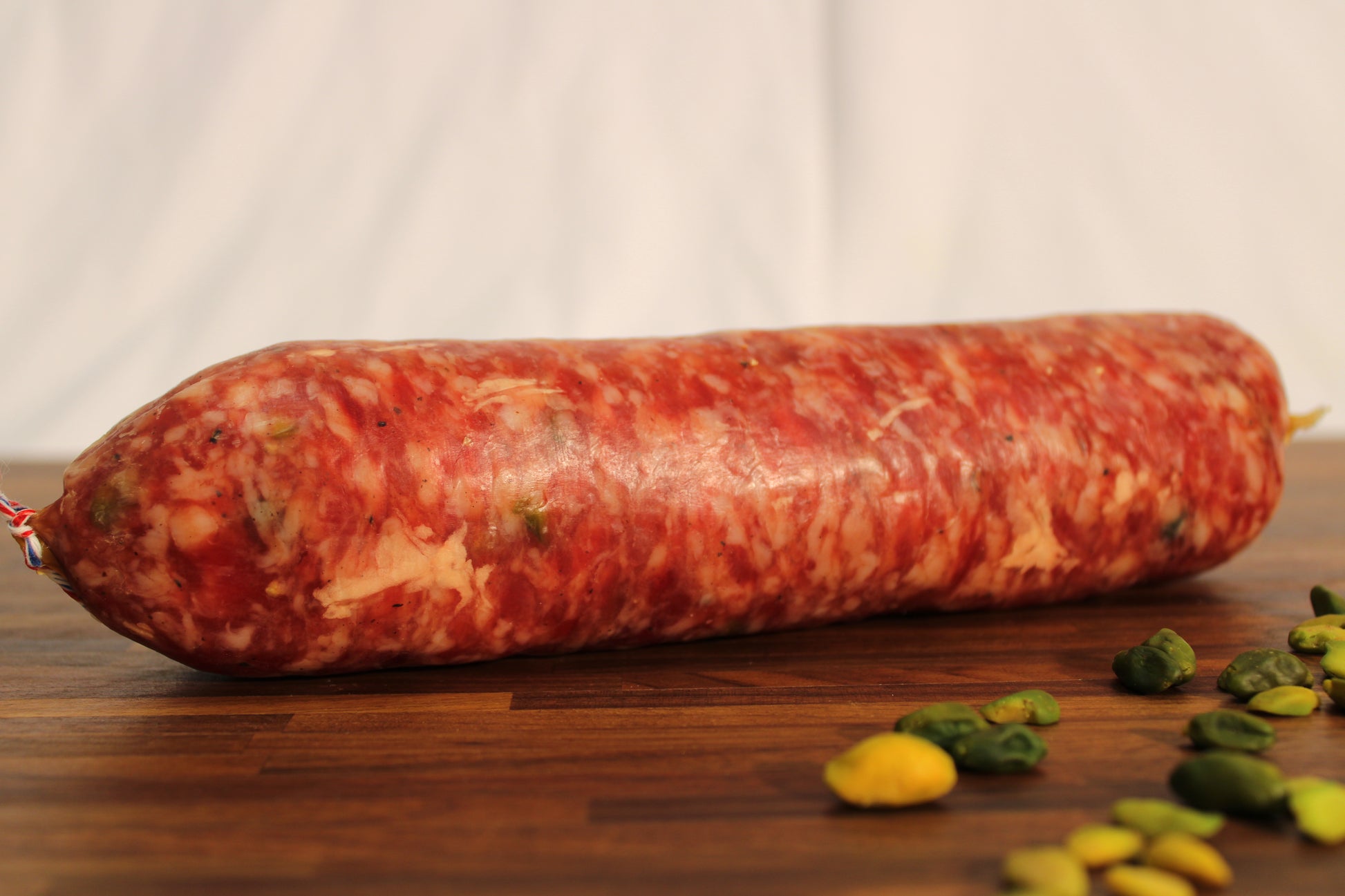 Saucisson à cuire Pistaché 2% - Charcuterie Père Anselme